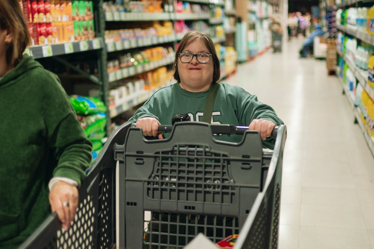 Woman with Down syndrome getting groceries